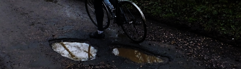 Featured image for article: How to ride on poor road surfaces with potholes